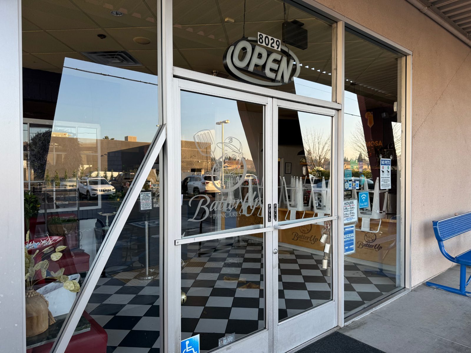 Spotless glass entry doors at Batter Up Pancakes in Fresno after a commercial window cleaning