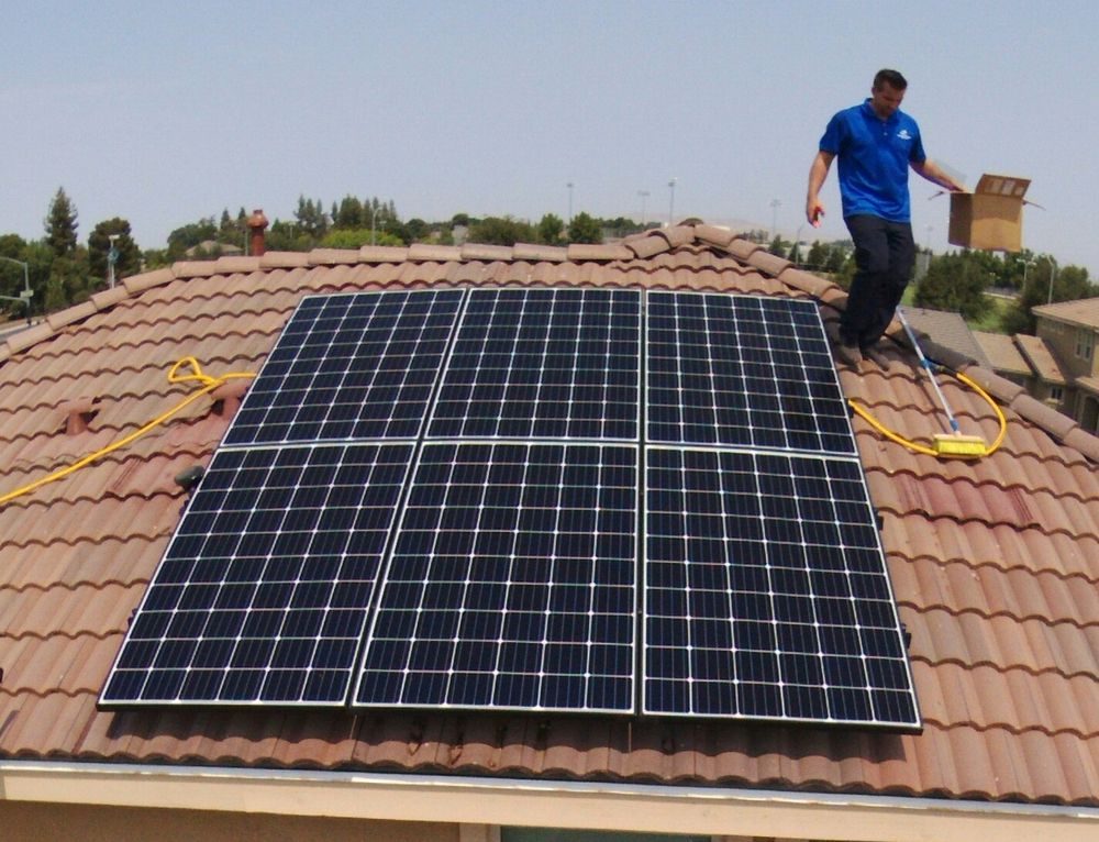 The same Fresno rooftop solar array clean and reflective after a Primetime purified-water wash